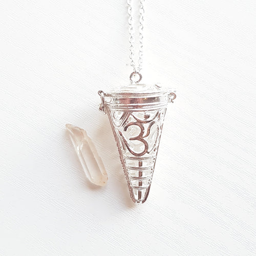 OM CAGE PENDANT WITH RAW CLEAR QUARTZ