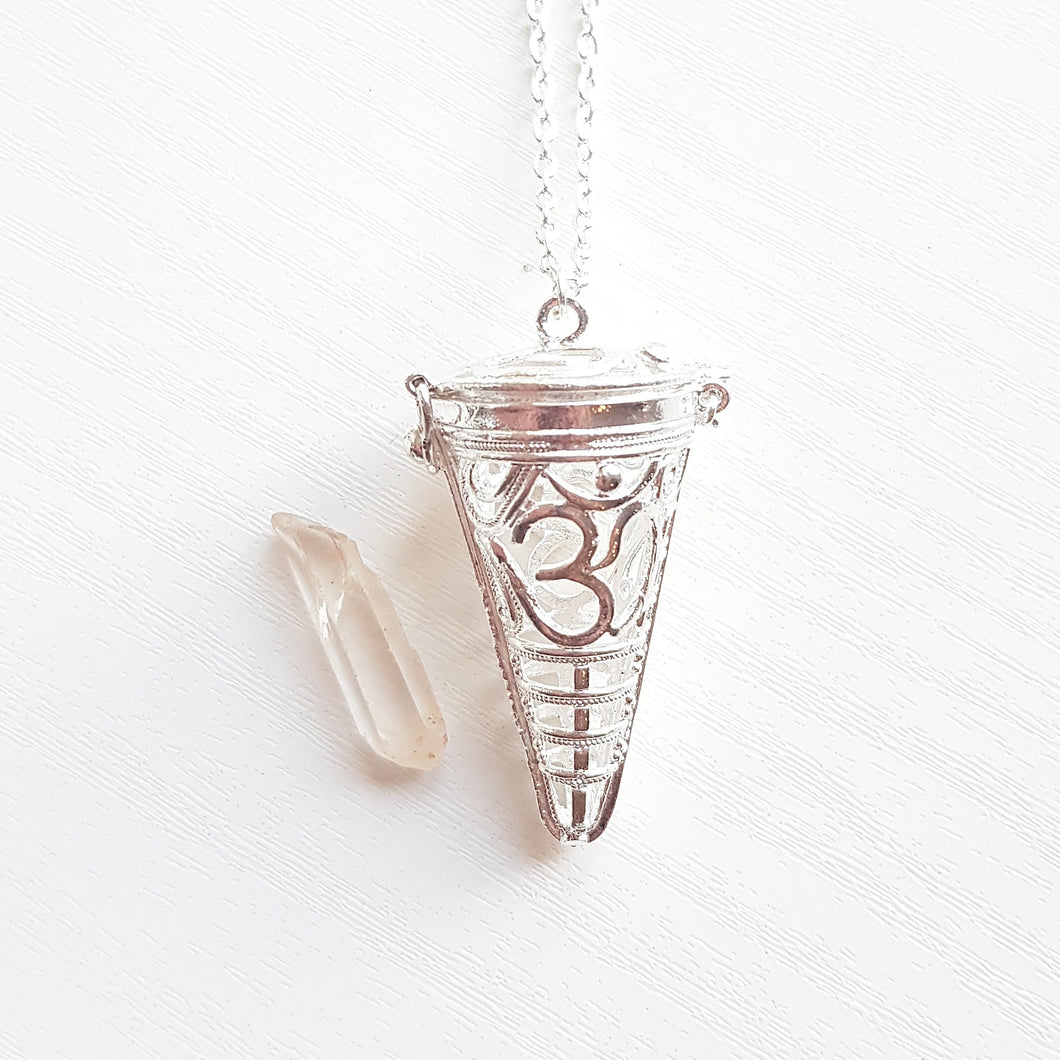 OM CAGE PENDANT WITH RAW CLEAR QUARTZ
