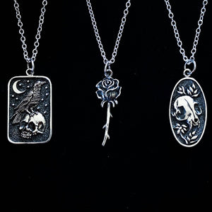 STERLING SILVER FLOWER AND CAT SKULL NECKLACE